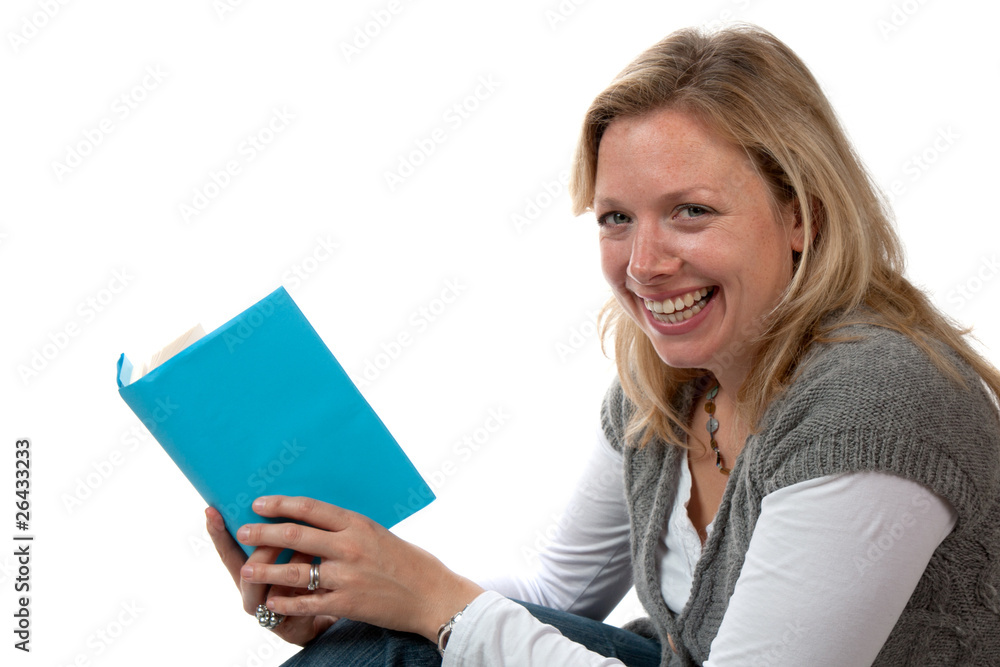 Blonde Woman Smiling, Sitting and Reading Blonde Woman Smiling, Sitting and Reading