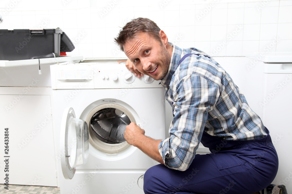 Plumber fixing broken washing machine Plumber fixing broken washing machine