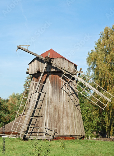 Antique wooden windmill at Pereiaslav-.Khmelnytskyi, Ukraine. photo