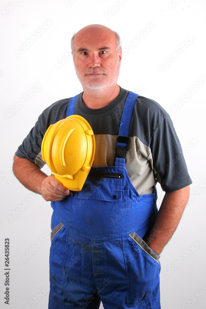 Senior plumber with protective helmet Senior plumber with protective helmet