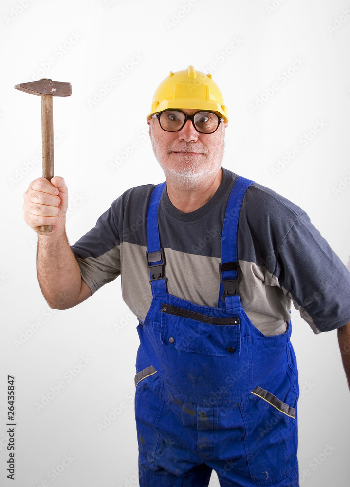 Senior plumber with hammer Senior plumber with hammer