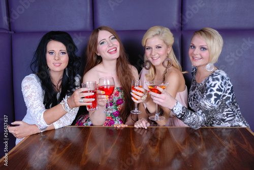 Happy young women at night club