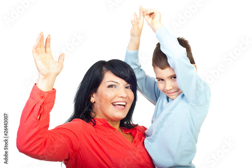 Mother with son raising hands