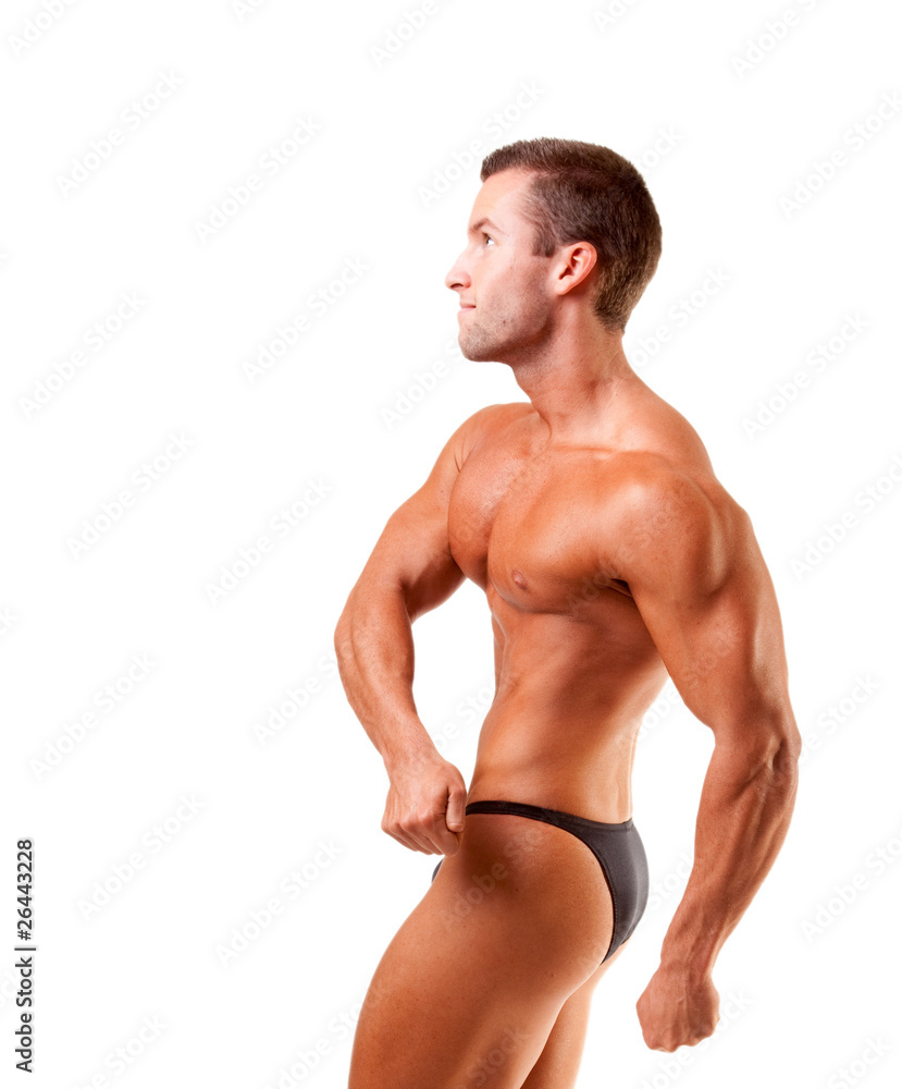 young bodybuilder posing over white backgound