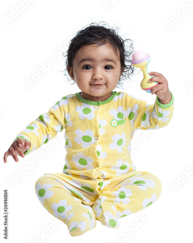 Smiling Baby Girl Playing with Rattle
