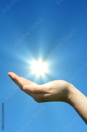 hand sun and blue sky