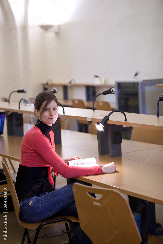 pretty female college student in a llibrary pretty female college student in a llibrary