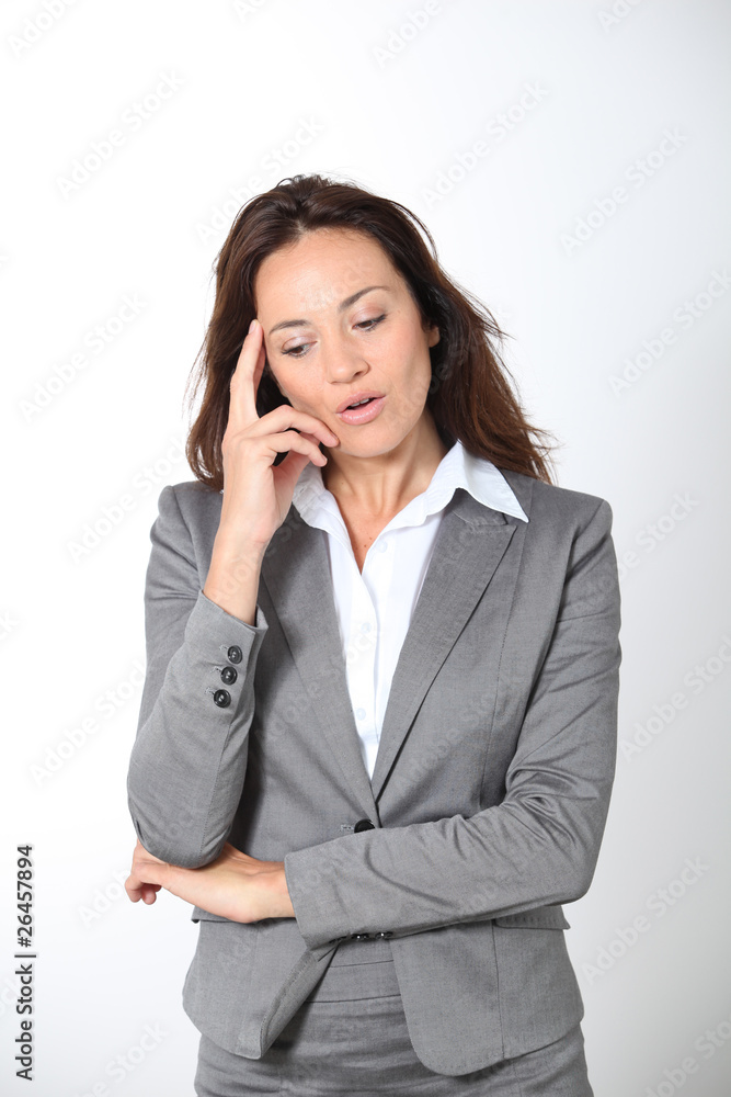 Thinking businesswoman on white background Thinking businesswoman on white background