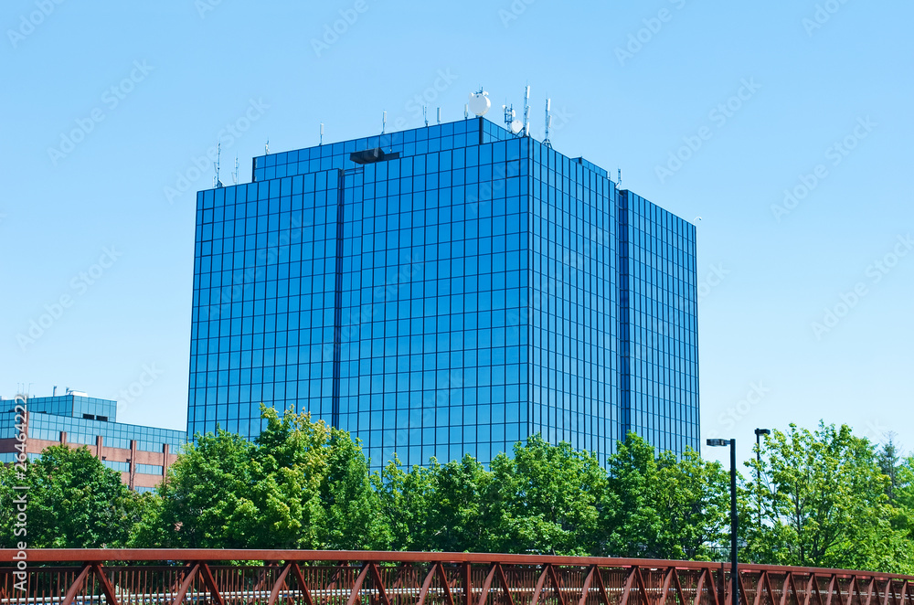 Blue modern office building with antennas