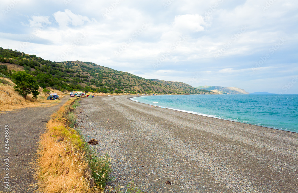 Family and camp on sea coastline Family and camp on sea coastline