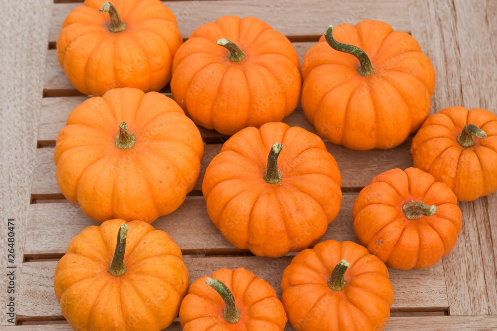 Pumpkins on wooden table Pumpkins on wooden table