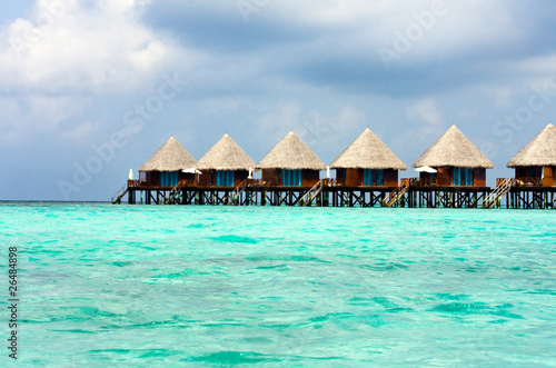 Maldives. .Villa on piles on water.