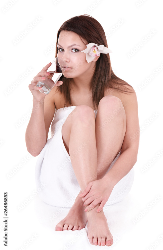 Beautiful young woman drinking water in spa. Beautiful young woman drinking water in spa.