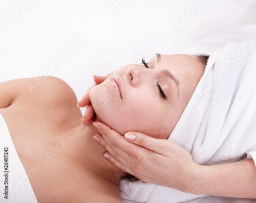 Young woman in spa. Facial massage.