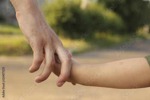 Man keeps hand a child © jura