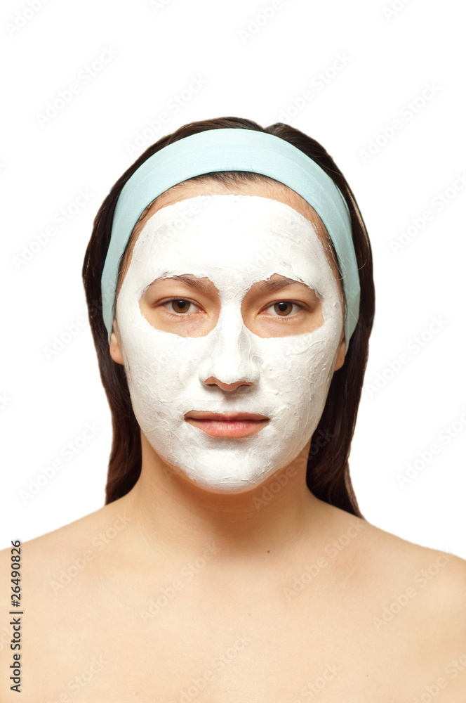 portrait of a young woman with beauty mask on her face isolated portrait of a young woman with beauty mask on her face isolated