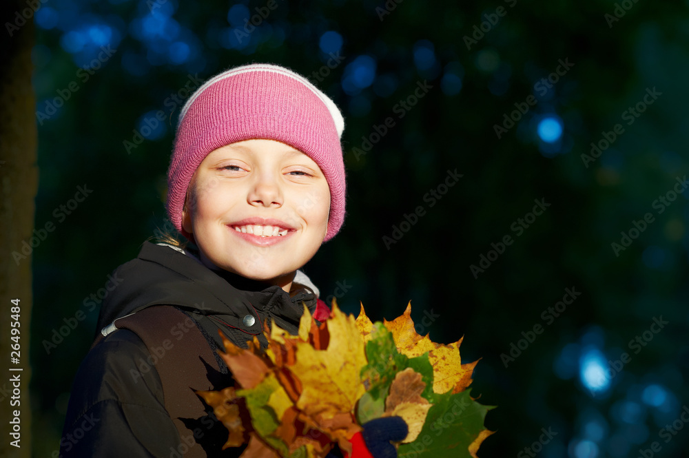 Outdoor portrait of cheerful smiling little girl