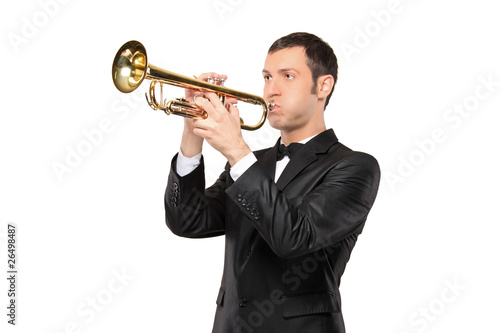 Man in a suit playing a trumpet