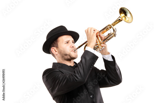 Man in a suit with a hat playing a trumpet photo