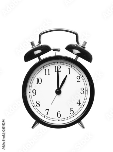 Alarm clock shows one o`clock