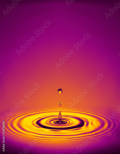 droplet with ripples in colored liquid