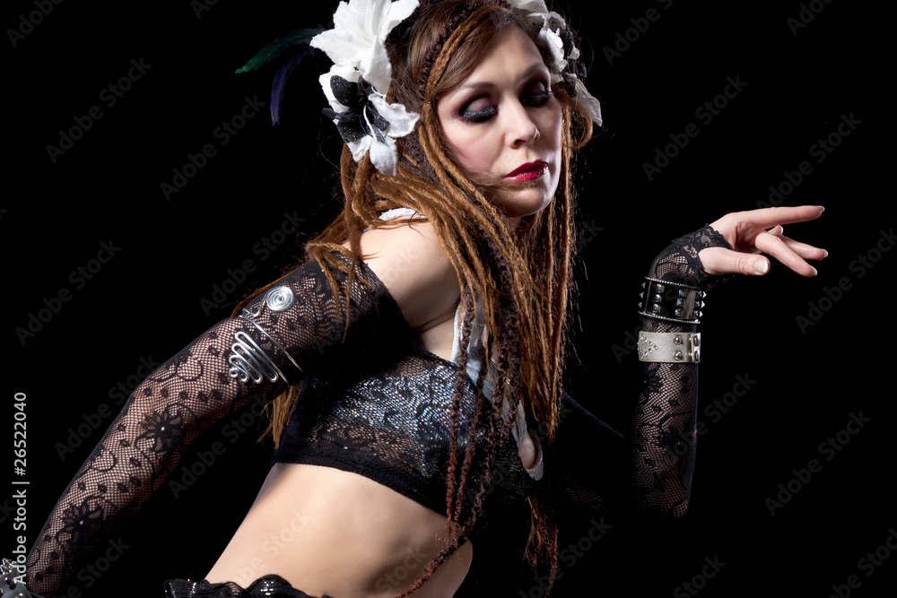 Attractive bellydancer dancing in tribal makeup and dress Attractive bellydancer dancing in tribal makeup and dress