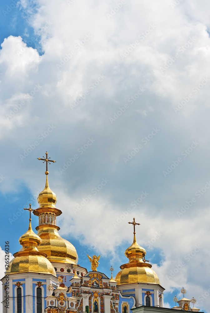 Cupola of Orthodox church and blue sky with clouds