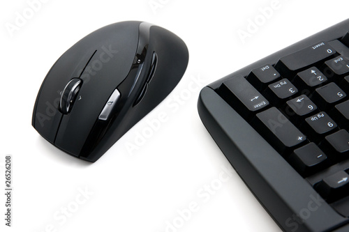 Computer keyboard and mouse isolated over white