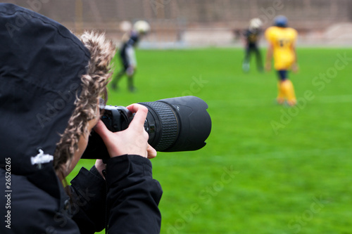 Professional photographer shooting rugby photo