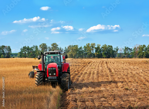 Tractors working on field