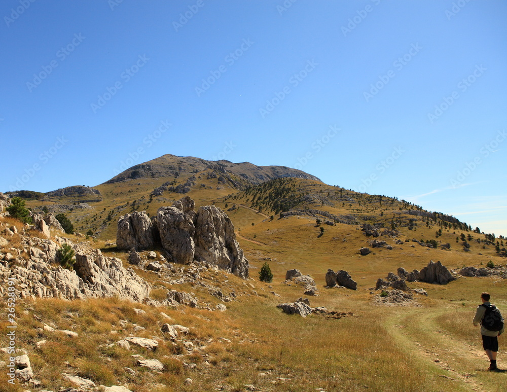 Hiker on the way to Dinara (Croatia) Hiker on the way to Dinara (Croatia)