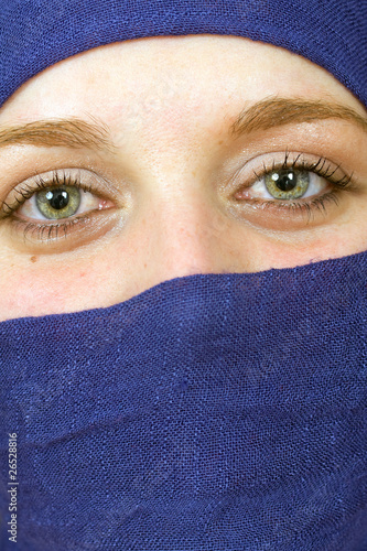 Close-up portrait a woman with blue vell, arabic style © cristovao31