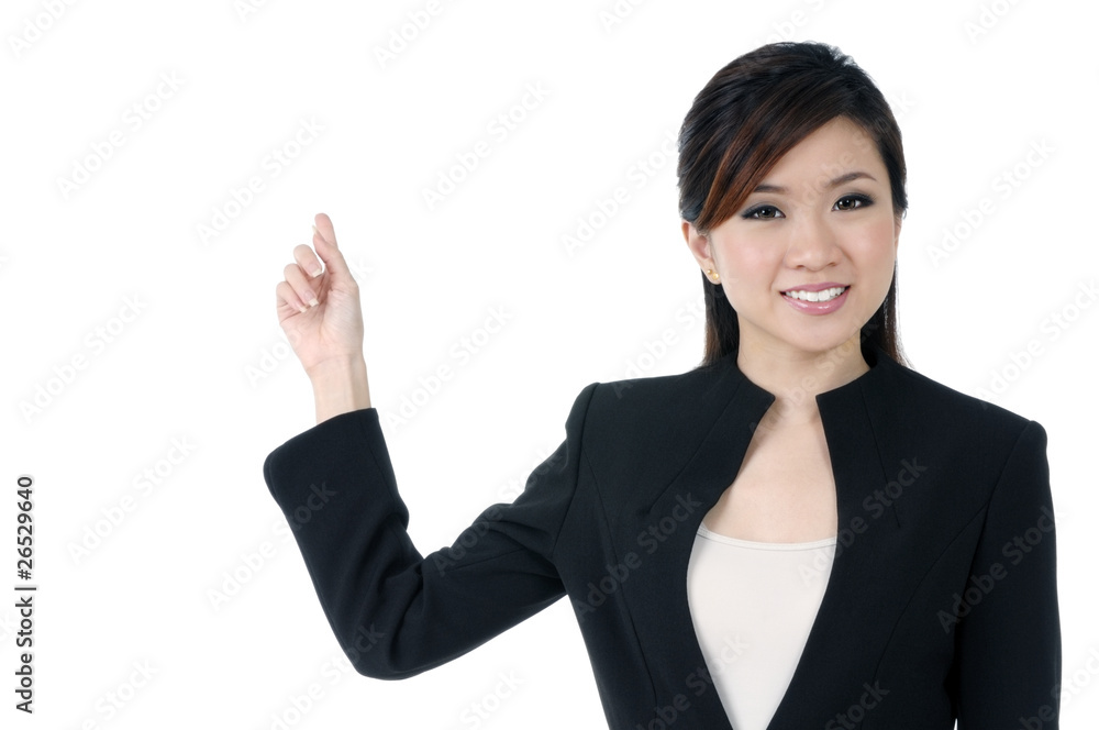 Beautiful young businesswoman pointing at copy space Beautiful young businesswoman pointing at copy space