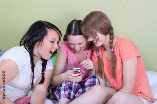 Teens reading text messages
