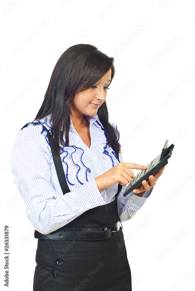 Young business woman using calculator Young business woman using calculator