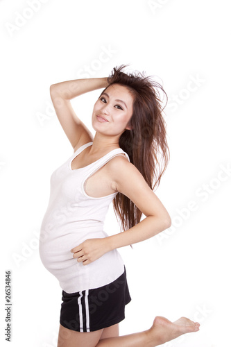 Pregnant woman running looking