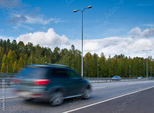 fast moving SUV car on highway © Tom Plesnik