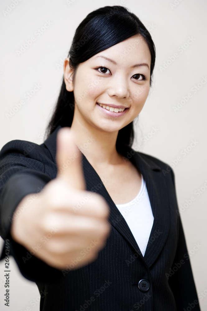 portrait of japanese business woman with showing thumbs up portrait of japanese business woman with showing thumbs up