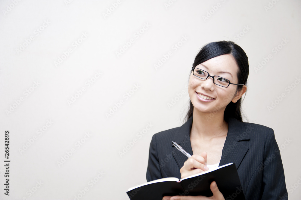 portrait of japanese business woman taking notebook portrait of japanese business woman taking notebook
