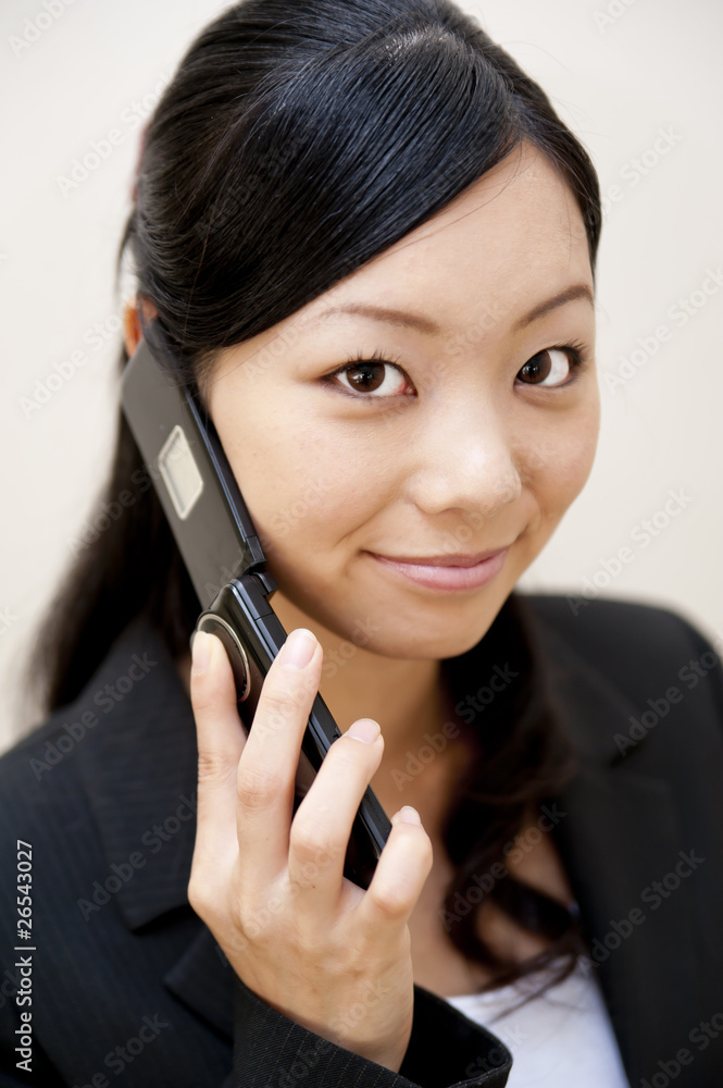 portrait of japanese business woman spearking on mobile phone portrait of japanese business woman spearking on mobile phone