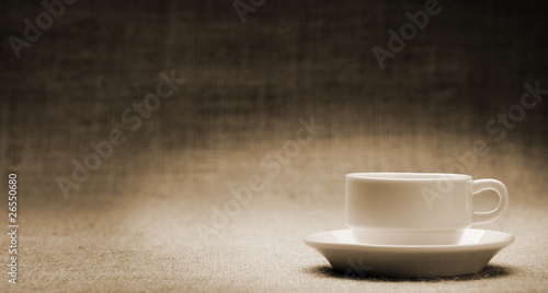 White cup on grunge a background