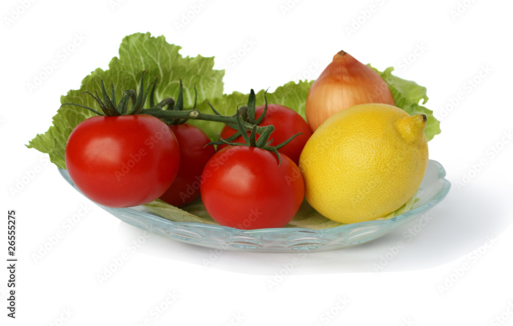 Vegetables for the salad on a white background Vegetables for the salad on a white background