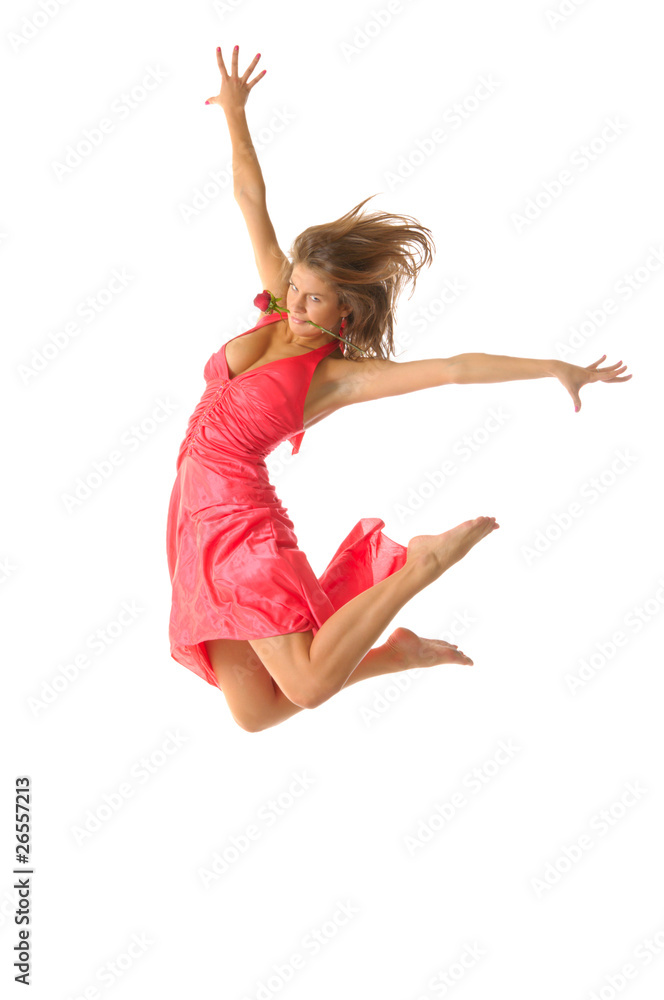 Sexual woman in jump with flowers in mouth