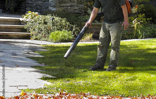 Landscaper operating Leaf Blower