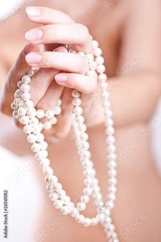 pearls in the women's hands