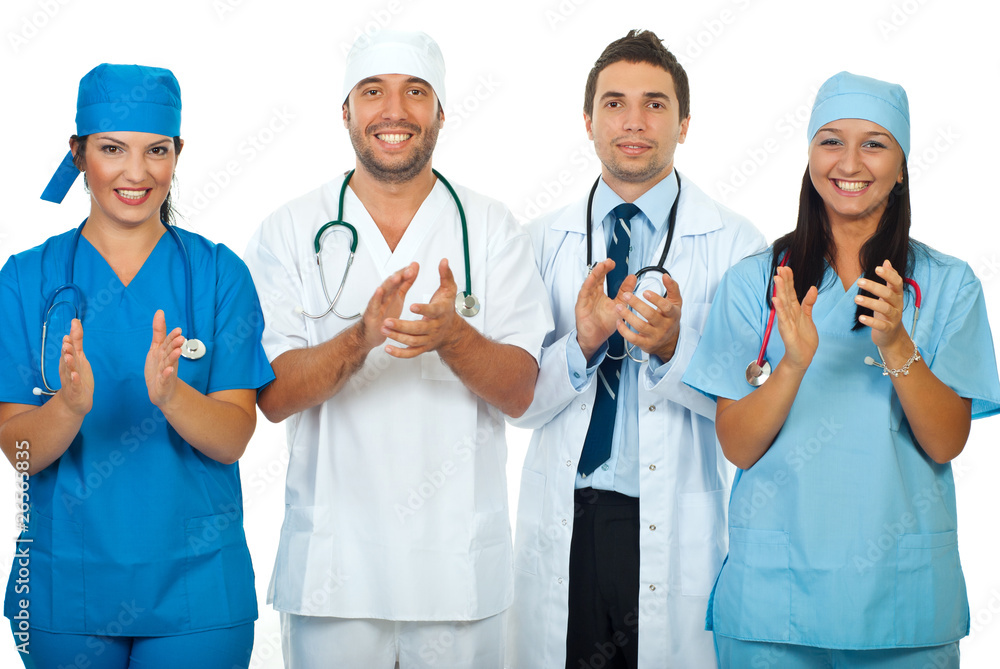 Successful team of doctors clapping together Successful team of doctors clapping together