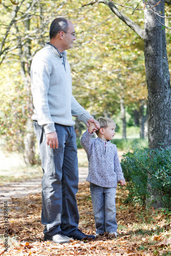 father and son in autumn park © Alena Yakusheva