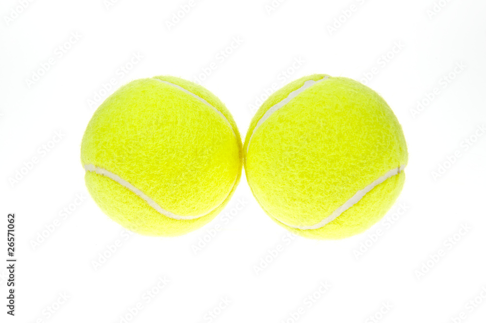two tennis balls on a white background