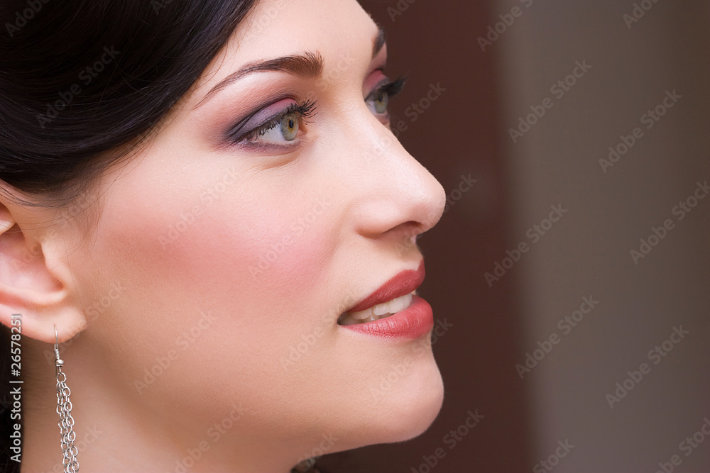 closeup profile to the brunette young lady bride