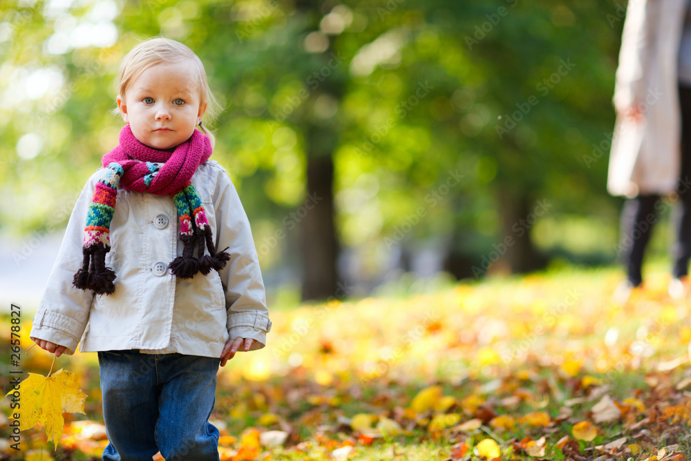 Toddler girl in autumn park Toddler girl in autumn park